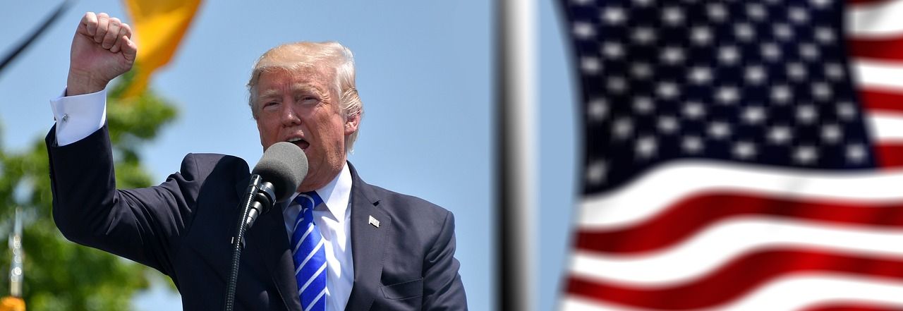 Dogecoin Gains, XRP Slumps as Trump Warns of 'Far Larger' Tariffs